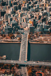 an aerial view of a city and a bridge