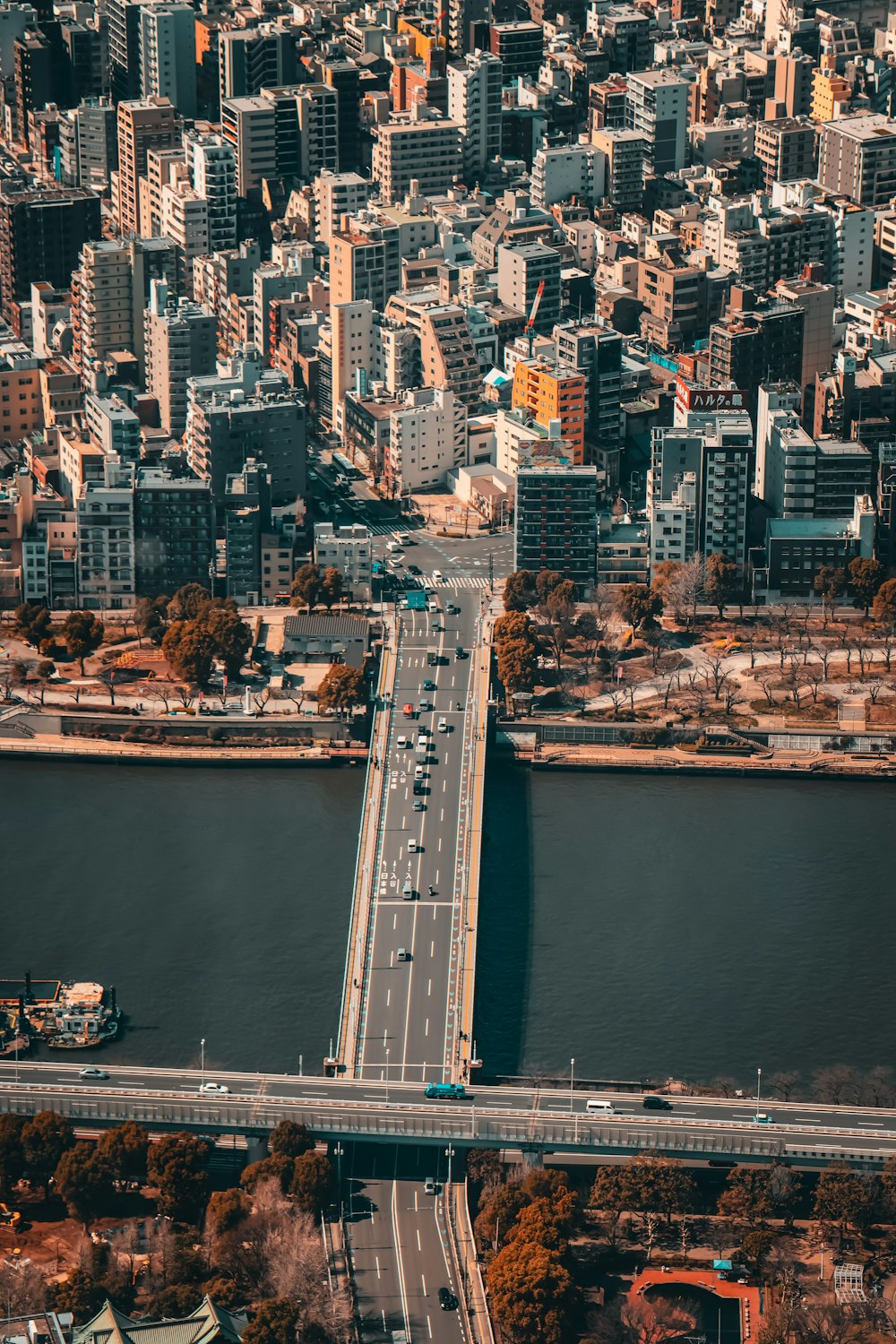 an aerial view of a city and a bridge