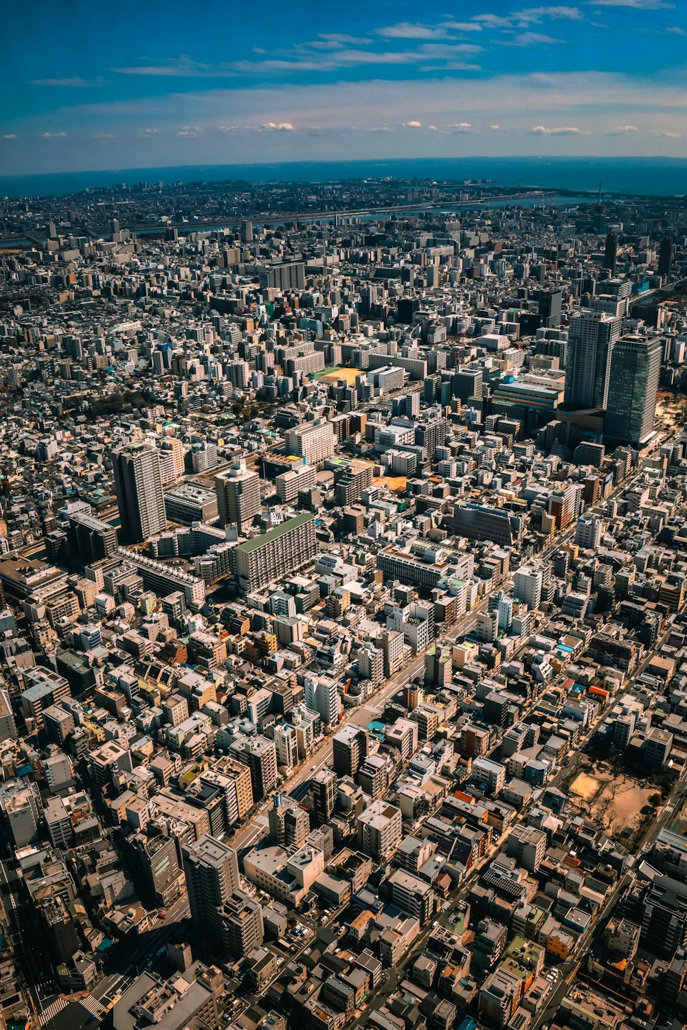 an aerial view of a city with tall buildings