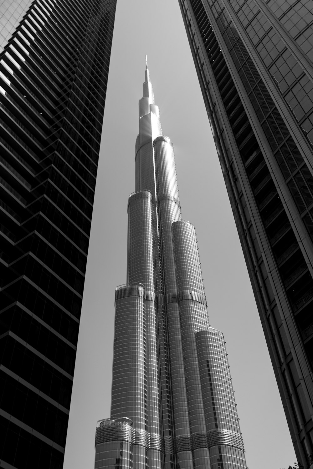 a black and white photo of the burj