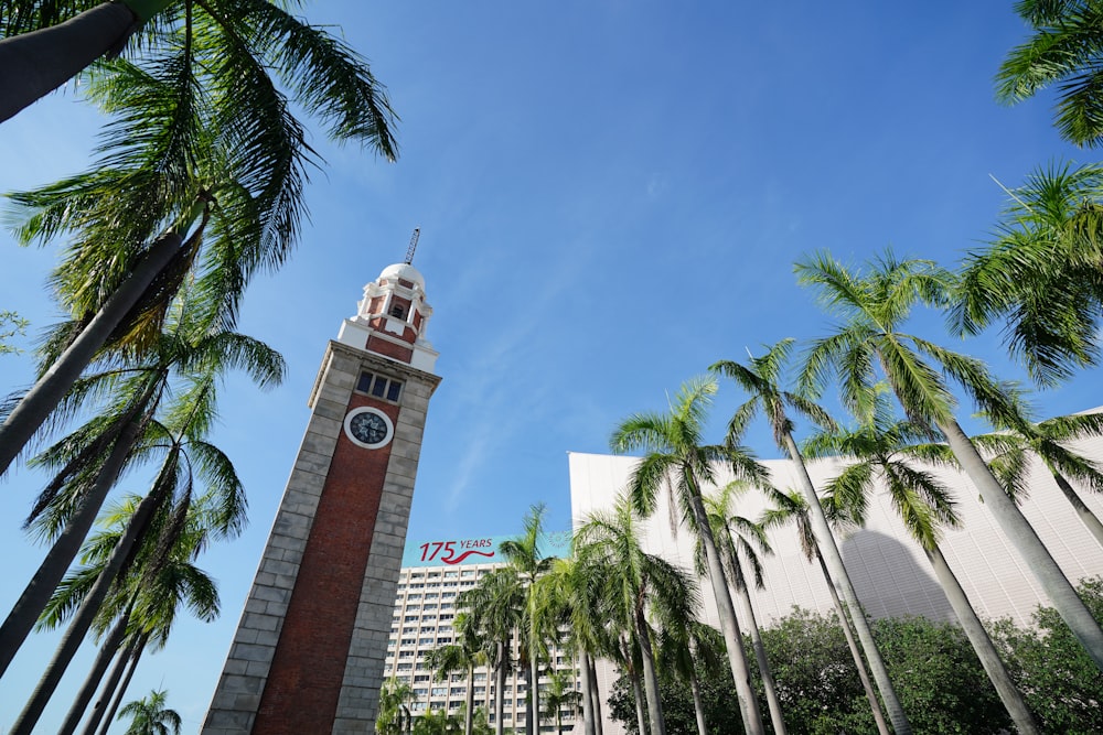 a tall clock tower with a clock on each of it's sides