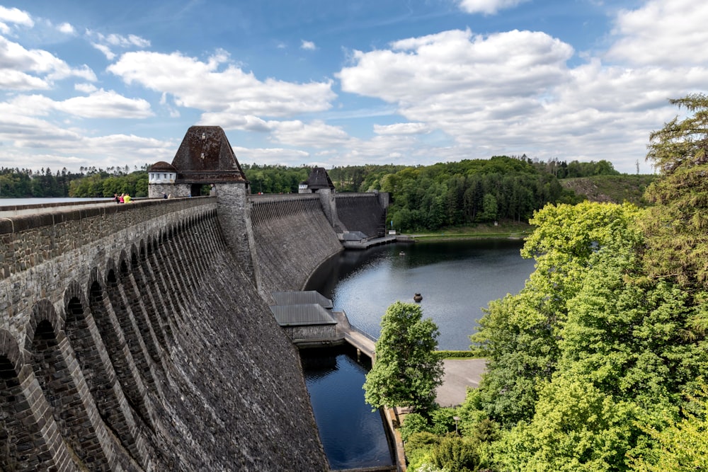 a view of a dam with a lake in the foreground