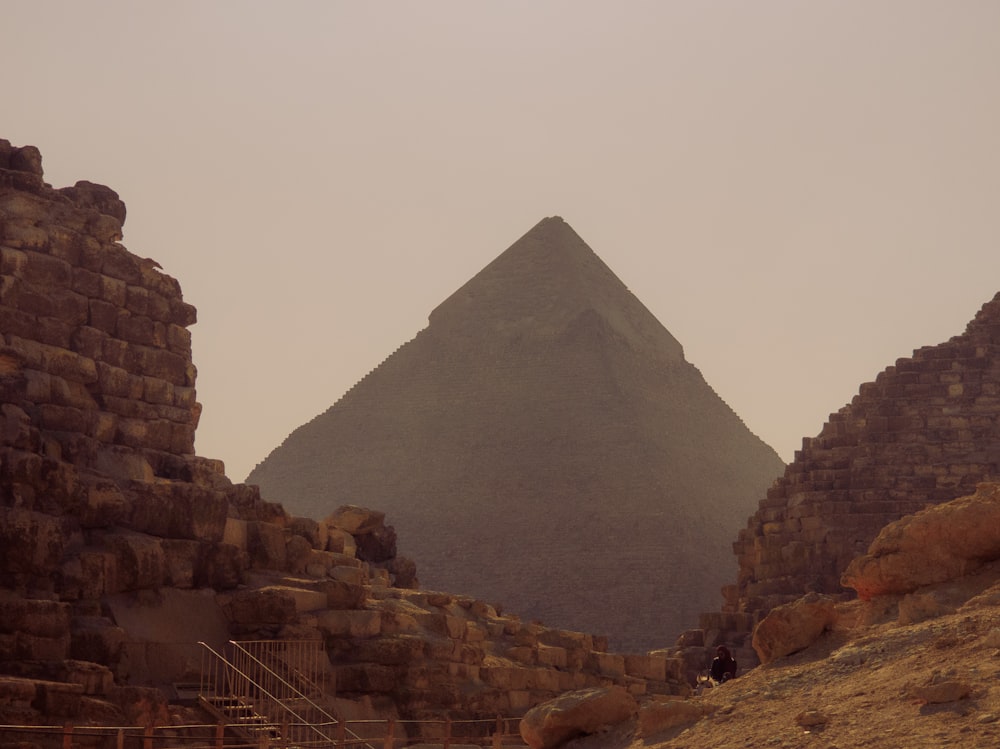 a very tall pyramid sitting in the middle of a desert