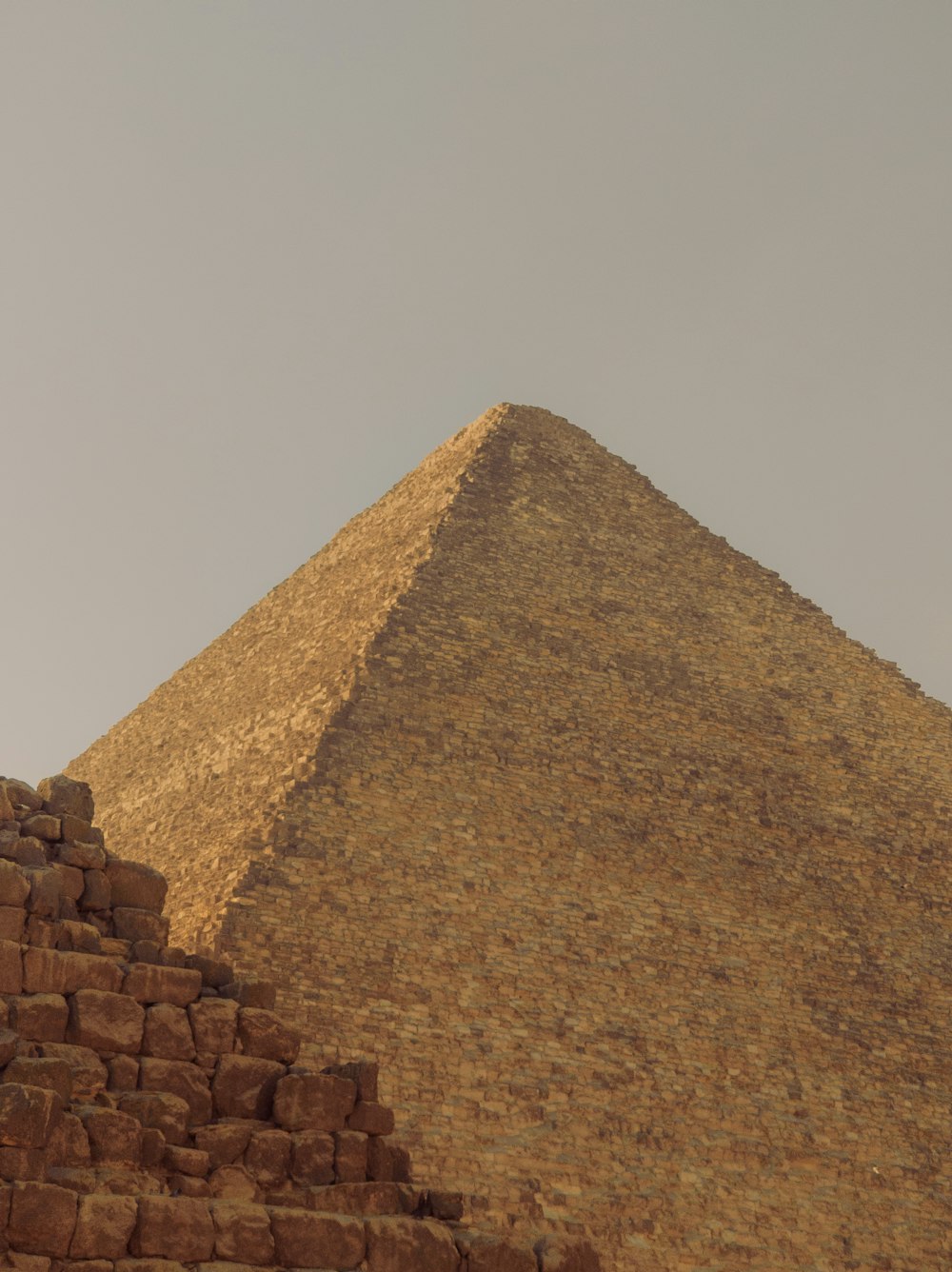 a very tall pyramid with a sky in the background