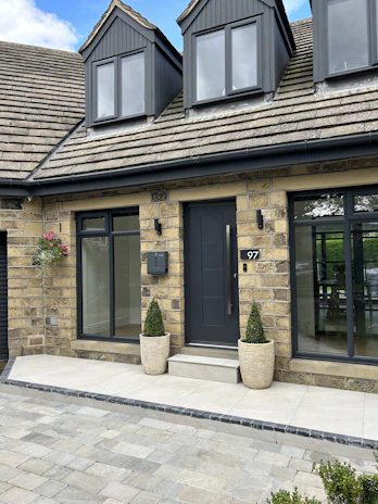 a house with two large planters in front of it