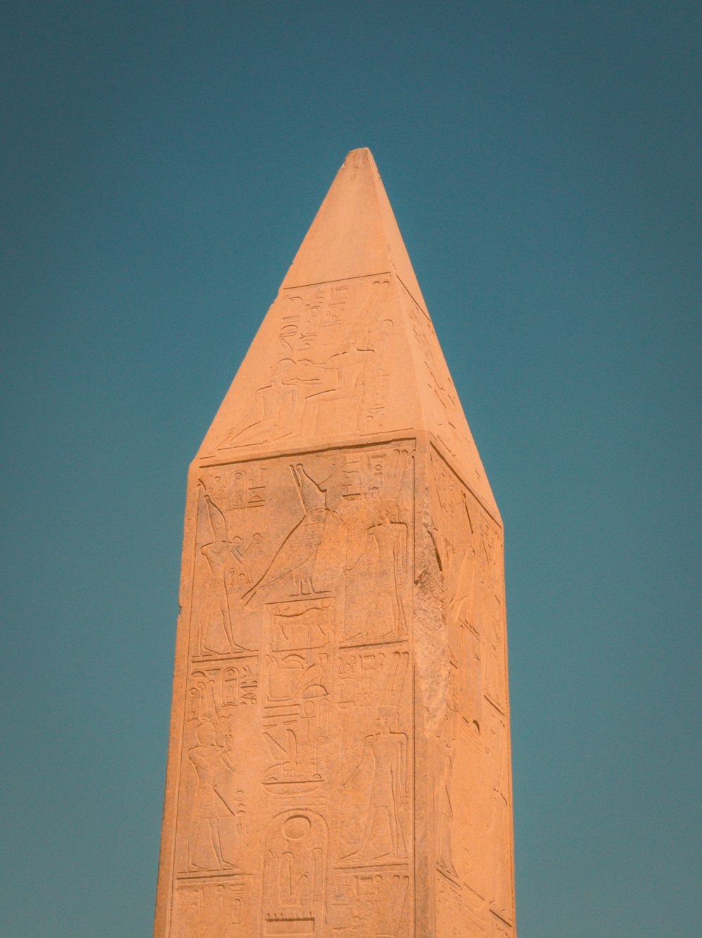 a tall obelisk with egyptian writing on it