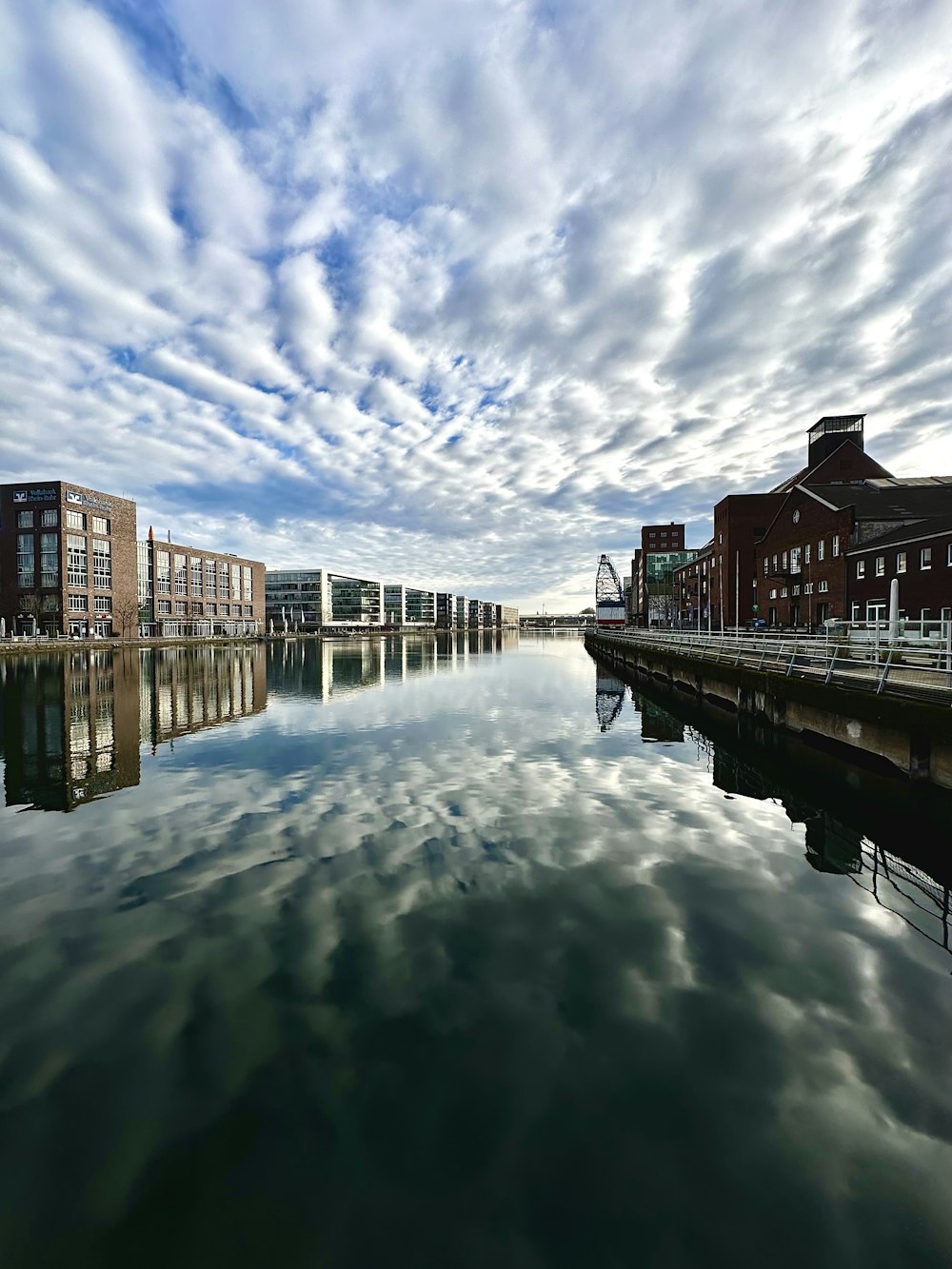 a body of water with buildings in the background