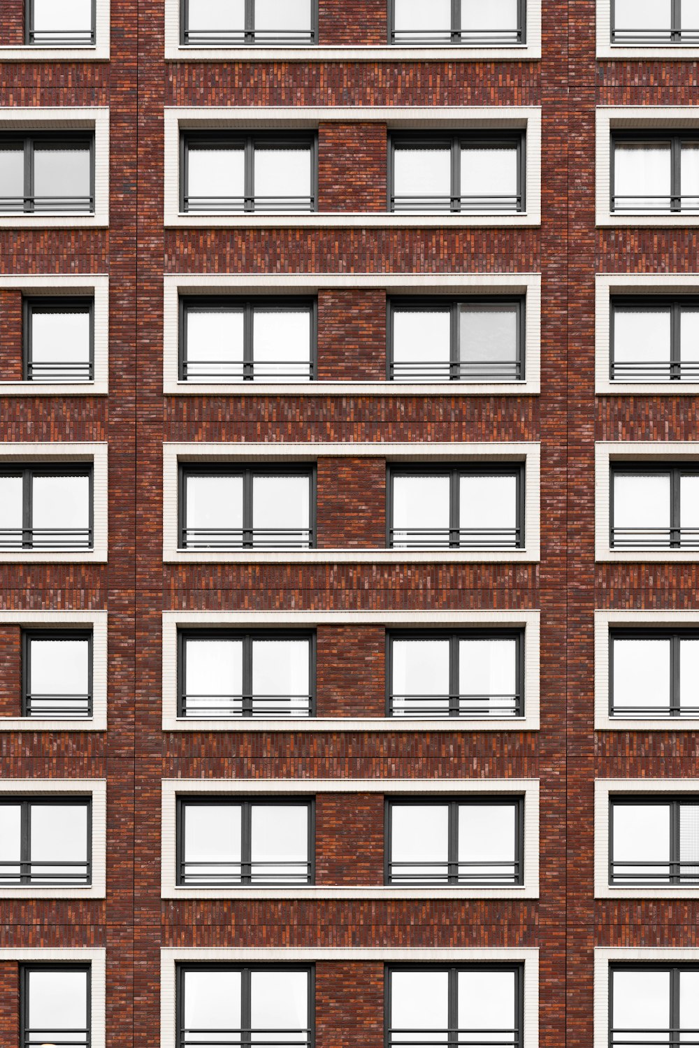 a tall brick building with lots of windows