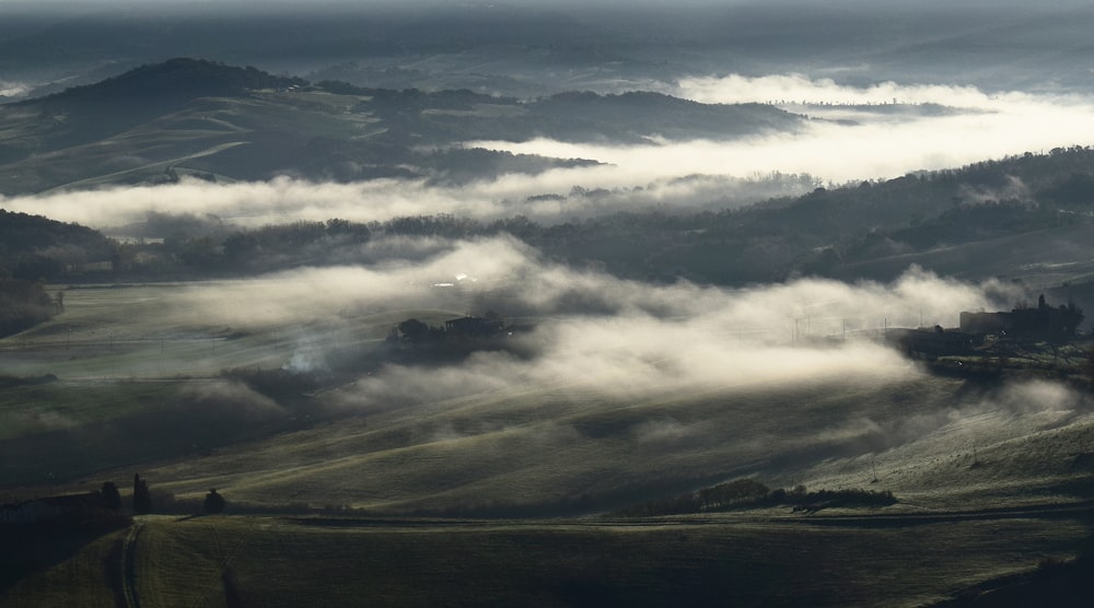 a view of a valley covered in fog