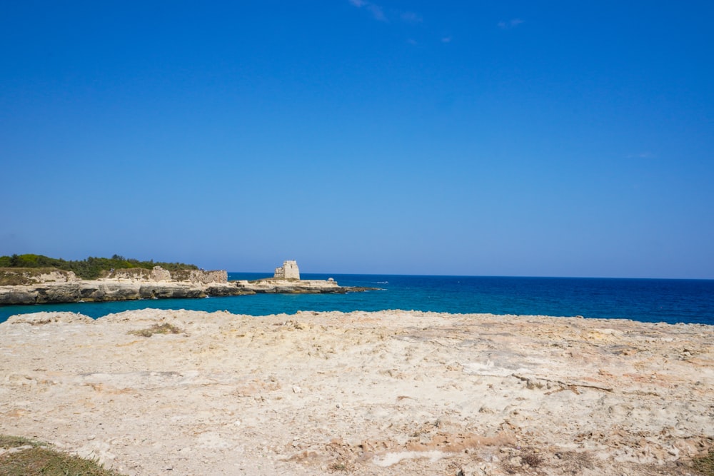 a view of the ocean from a rocky shore