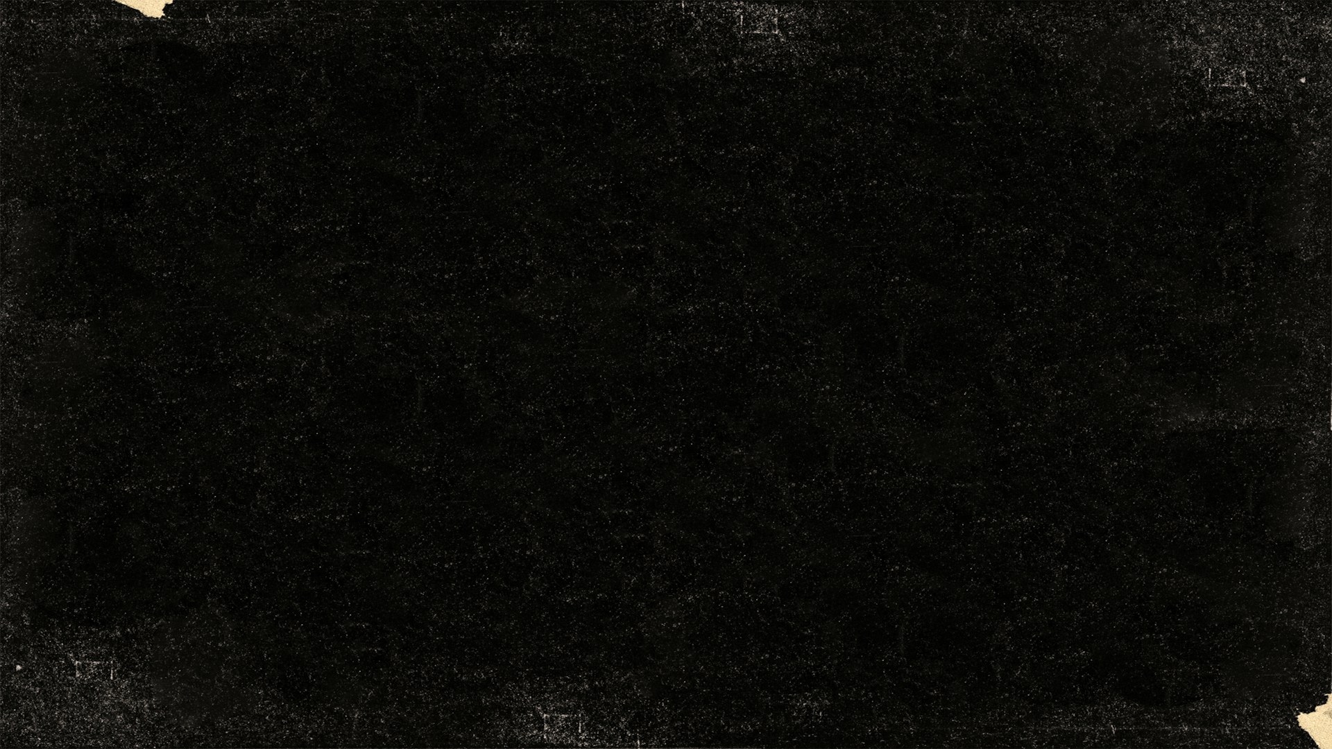 an old black paper with a torn edge