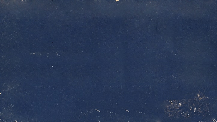 a black and white photo of a blue background