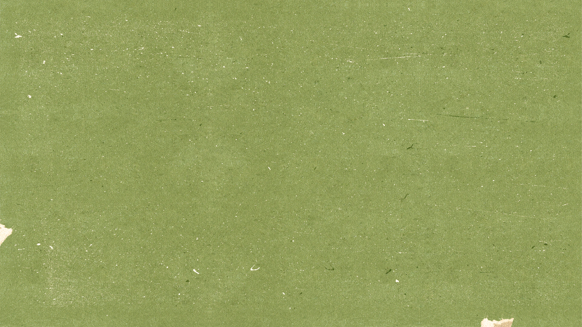 a piece of paper with torn edges on a green background