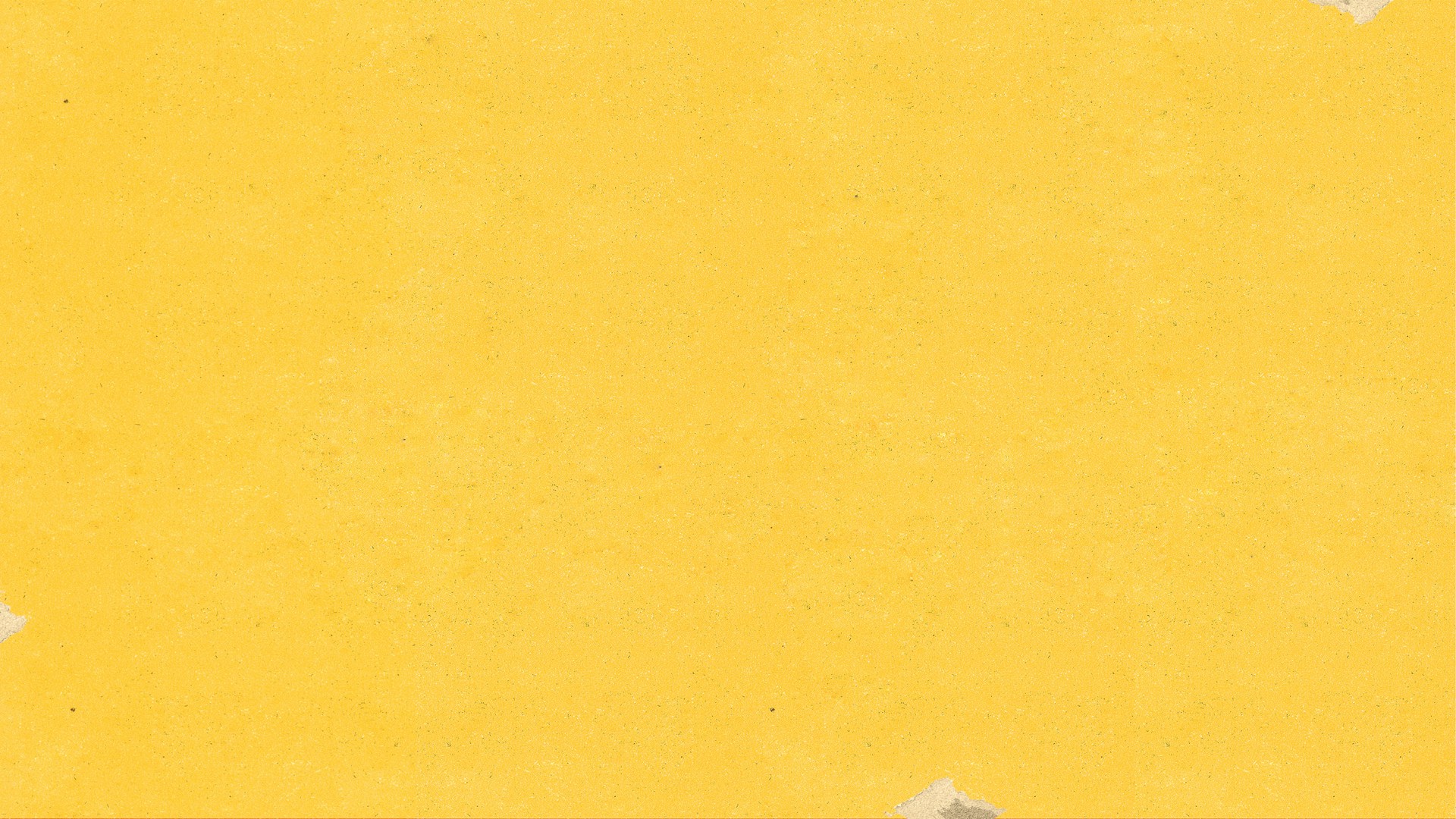 a piece of yellow paper with torn edges
