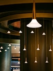 a group of lights that are hanging from a ceiling