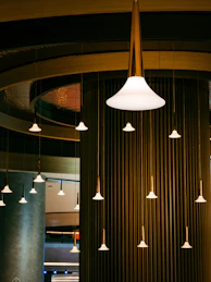 a group of lights that are hanging from a ceiling