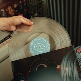 a person holding a record in their hand