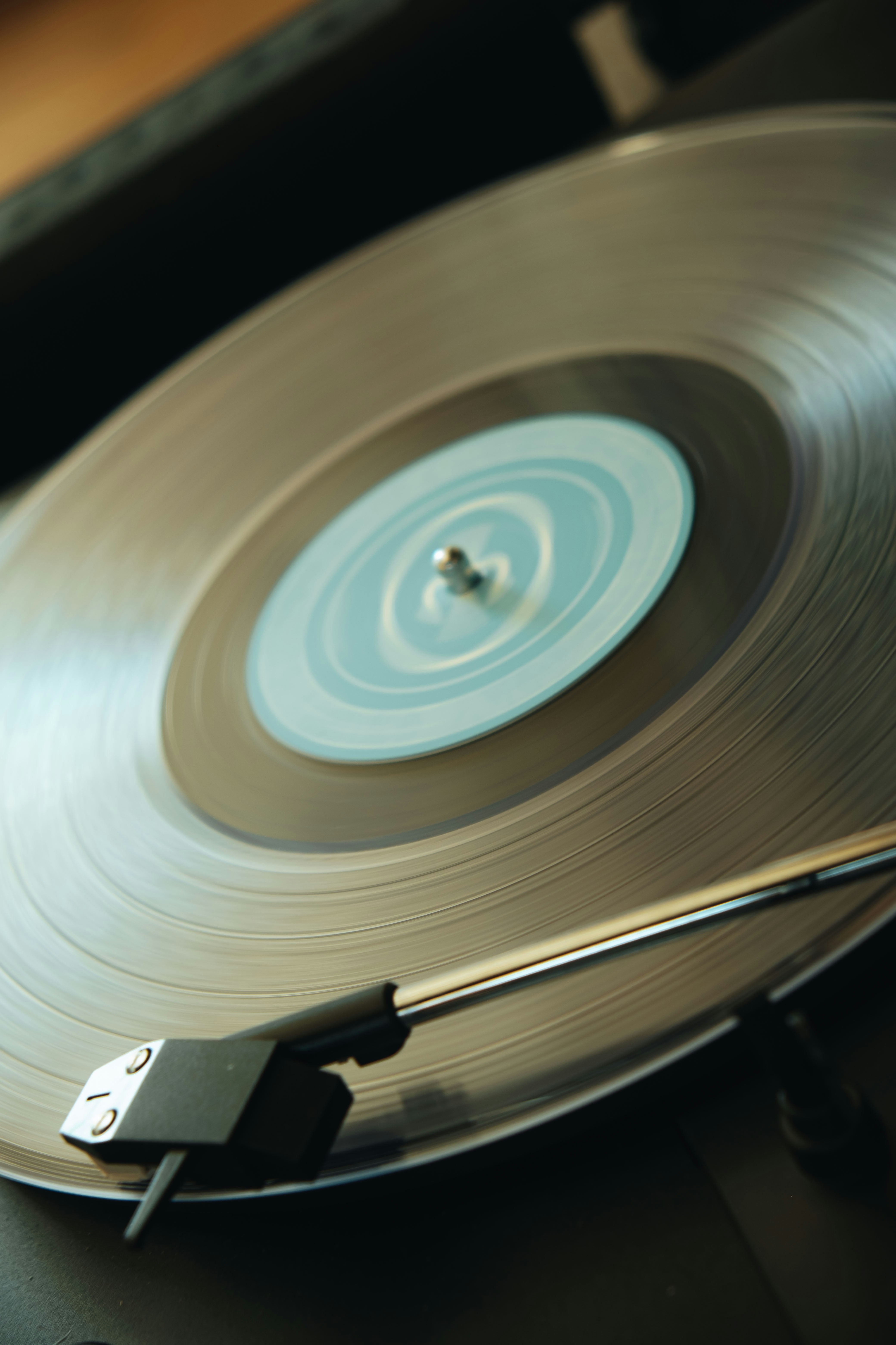 a turntable with a silver record on top of it