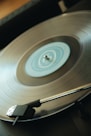 a turntable with a silver record on top of it