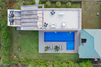 an aerial view of a house with a swimming pool