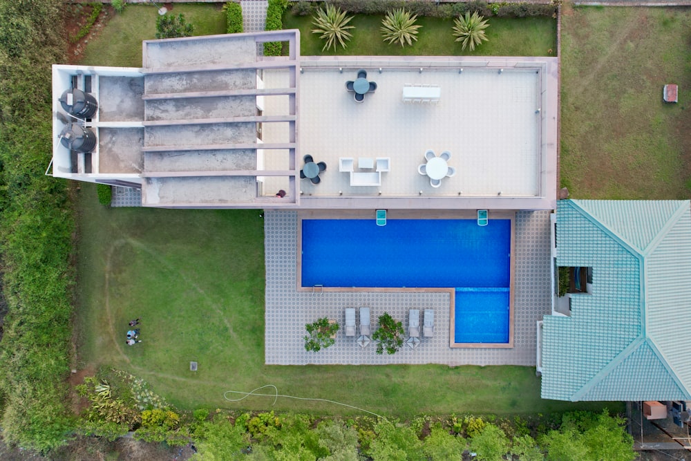 an aerial view of a house with a swimming pool