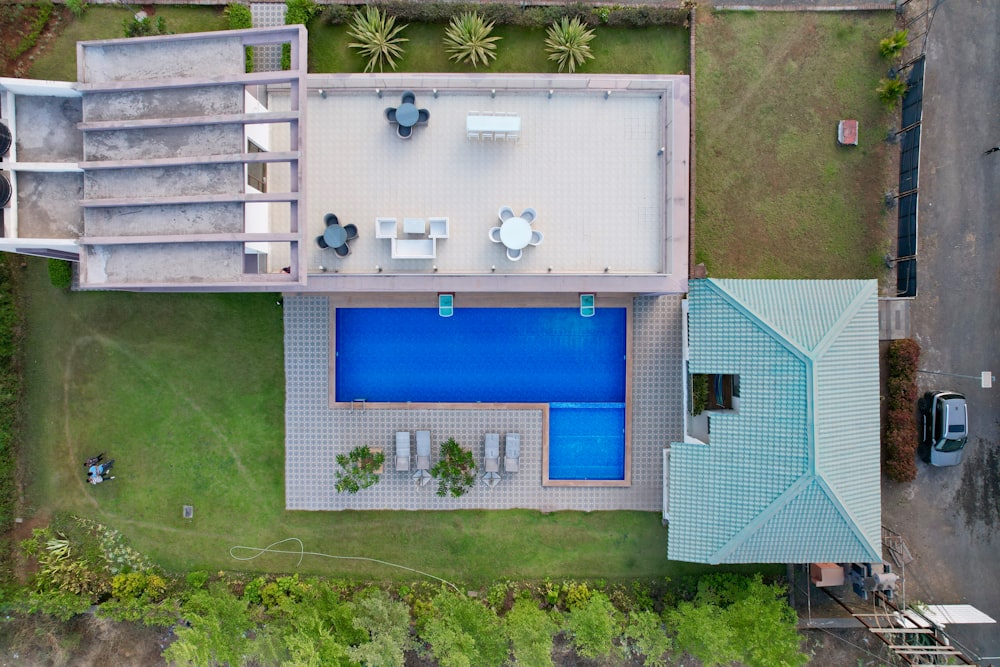 an aerial view of a house with a swimming pool