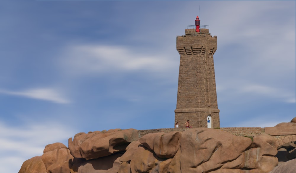 a tall stone tower with a sky background