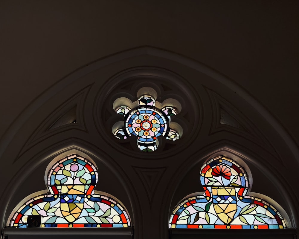 two stained glass windows in a church