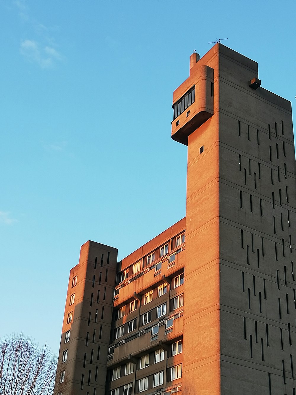 a tall building with a clock on the top of it