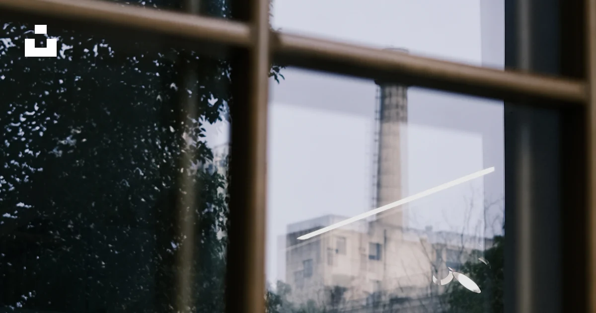 A view of a factory from a window photo – Free Sword Image on Unsplash