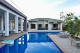 a house with a pool in the middle of it