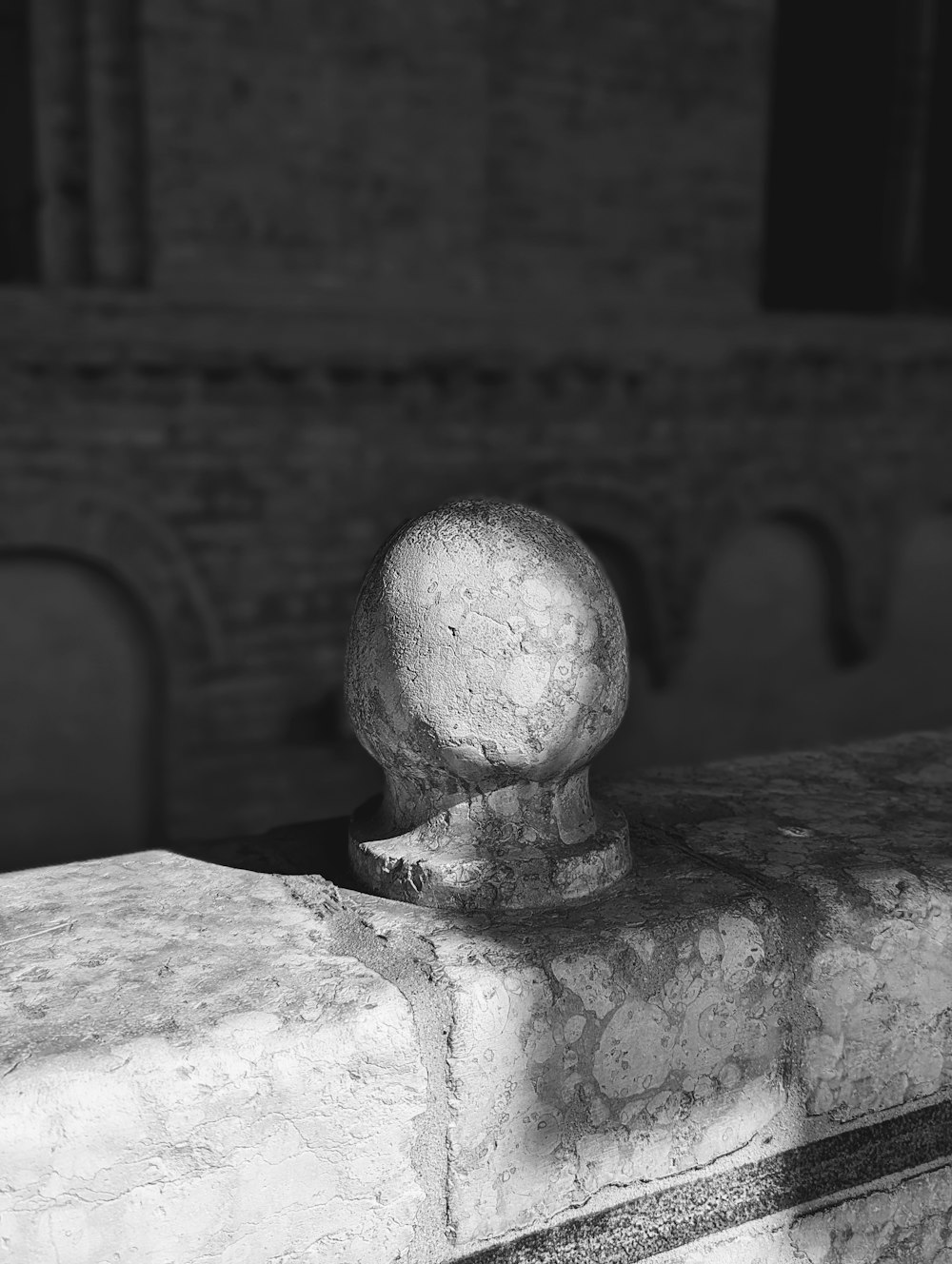 a black and white photo of a stone object