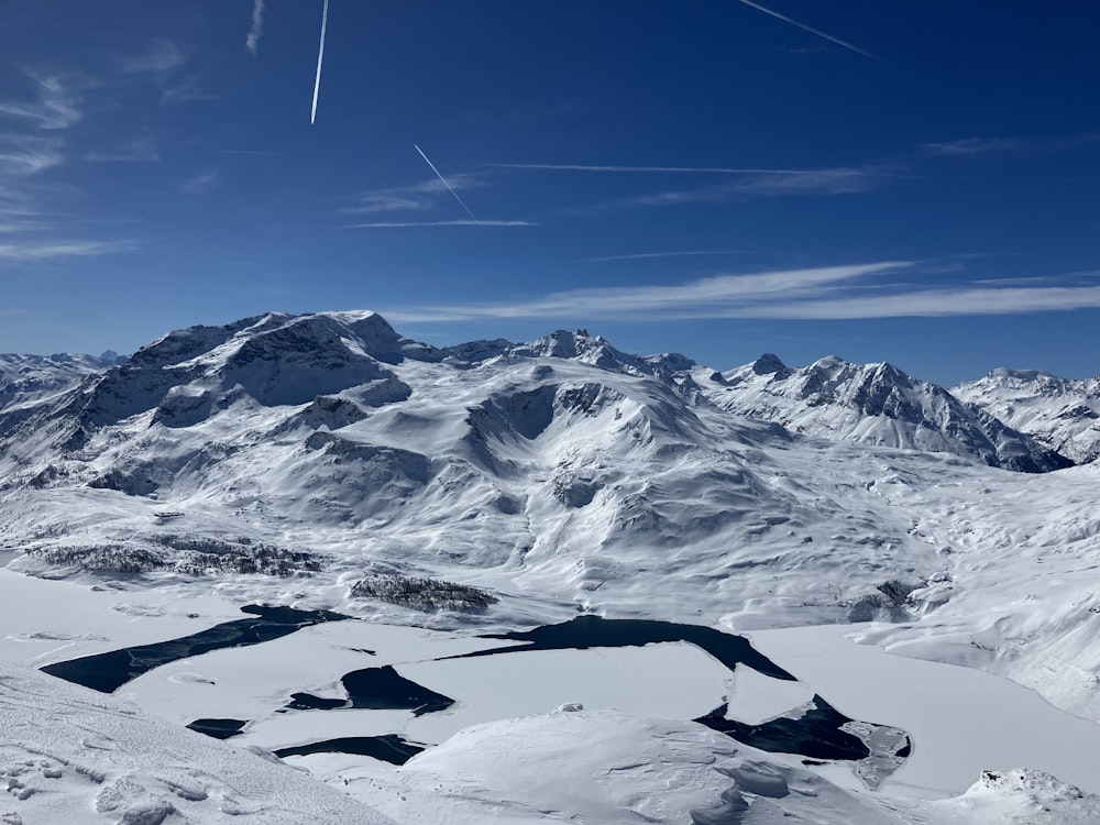 a view of a snow covered mountain range