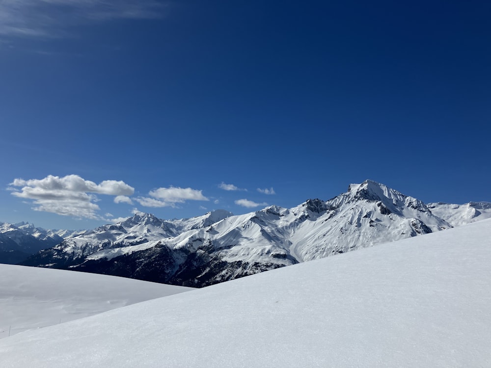 a view of a mountain range from a ski slope