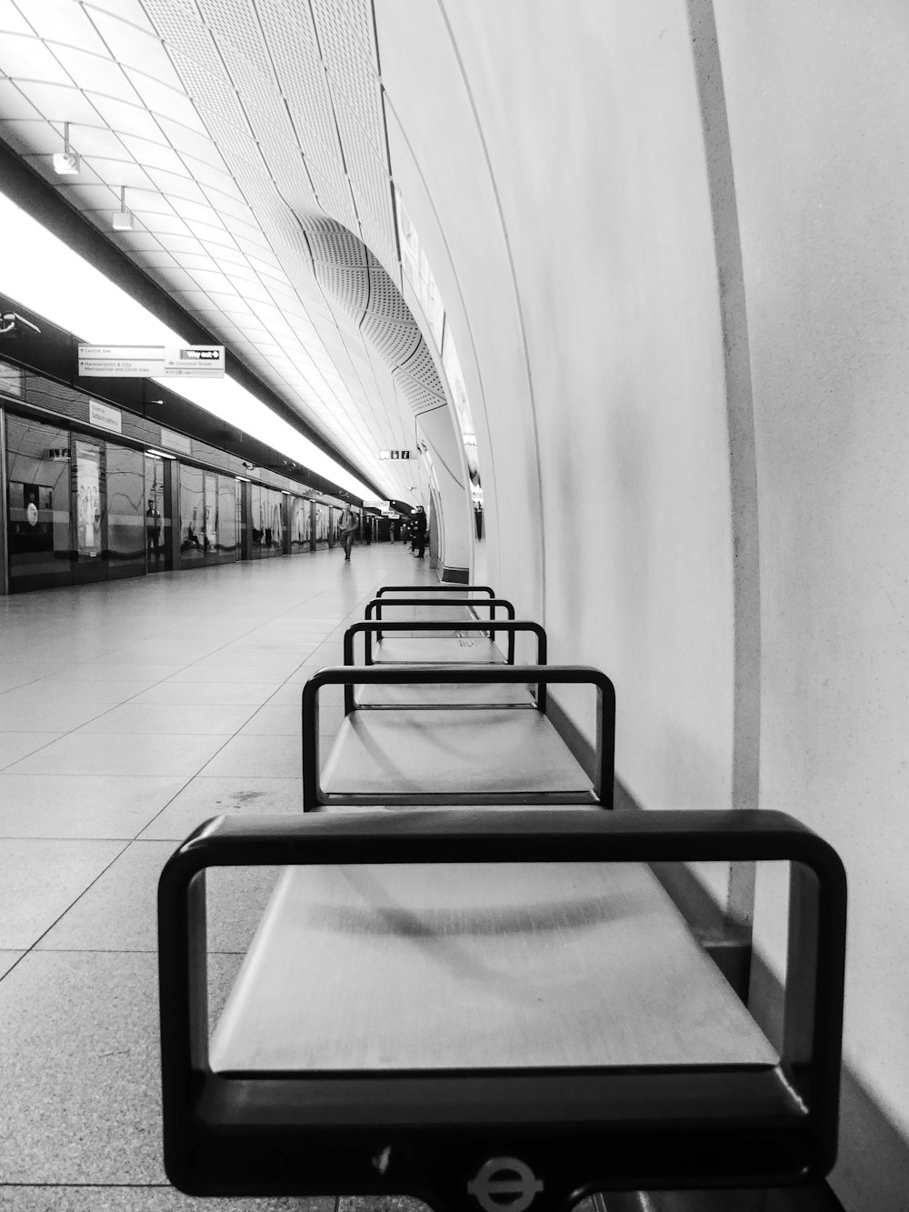 a black and white photo of a train station