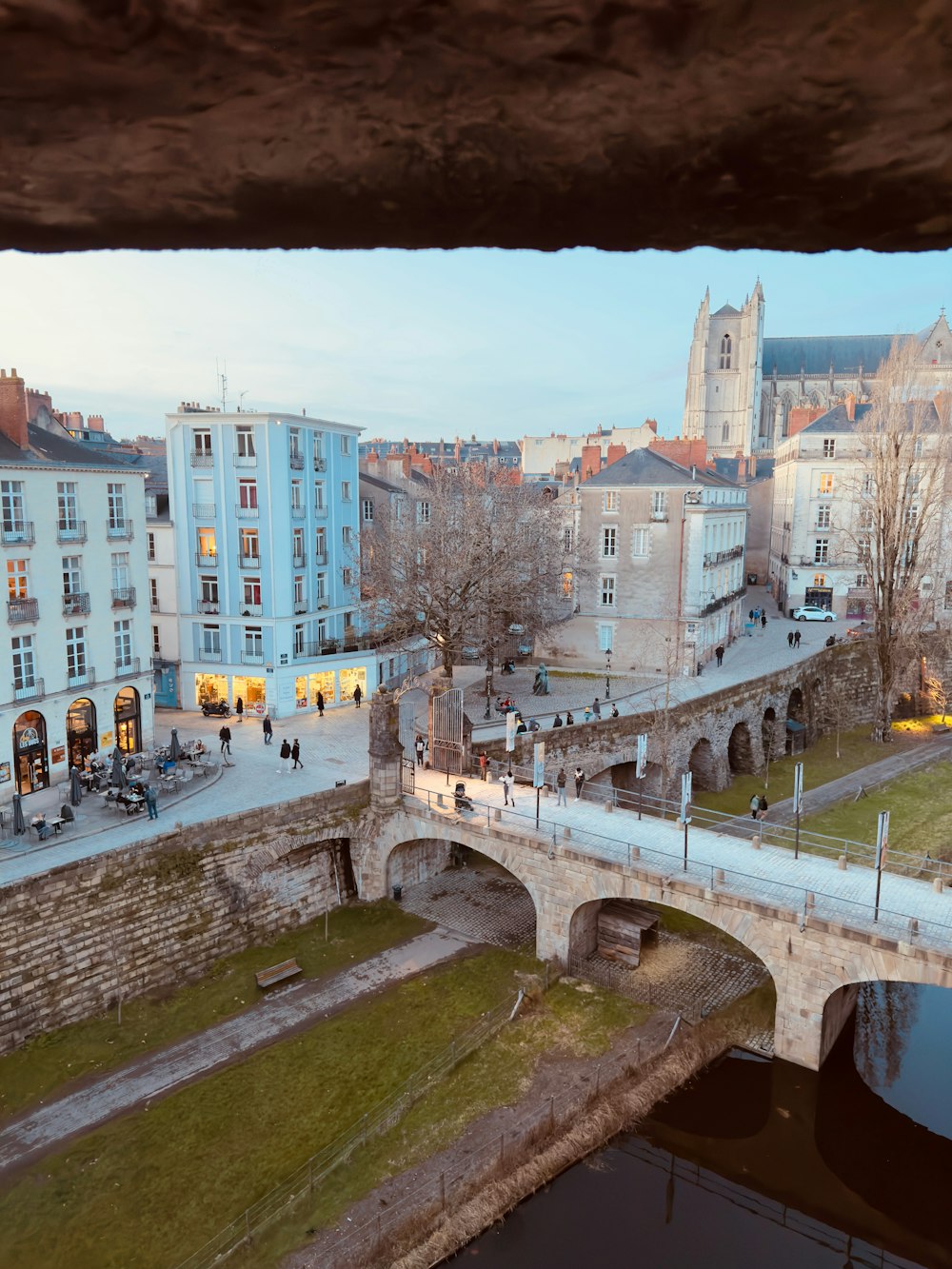 a bridge over a river in a city