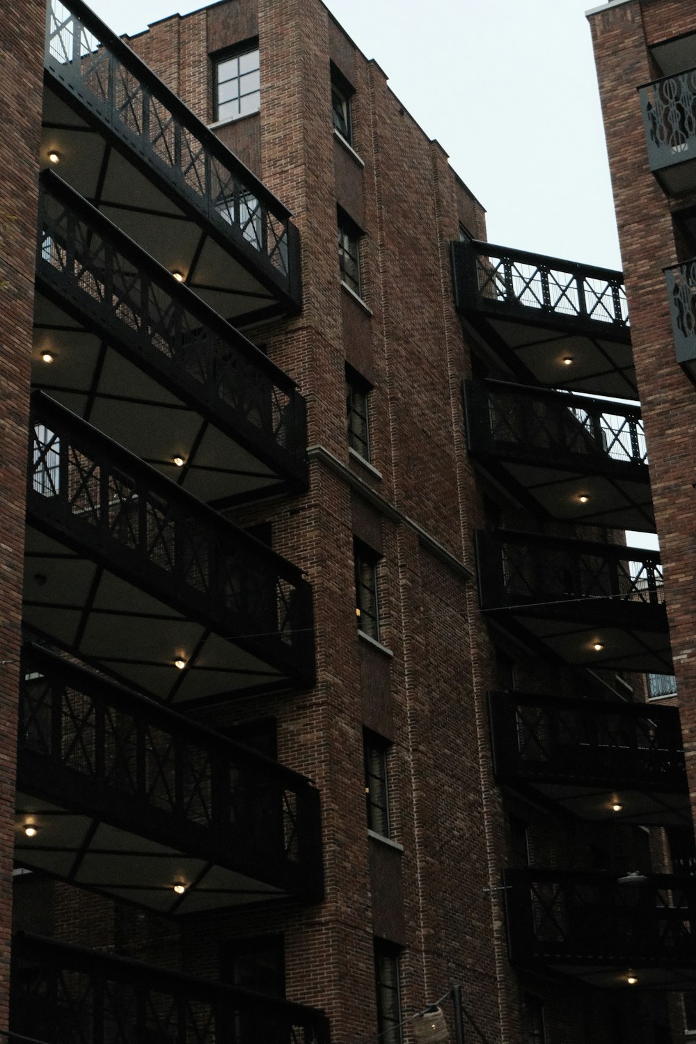 a clock on the side of a tall building