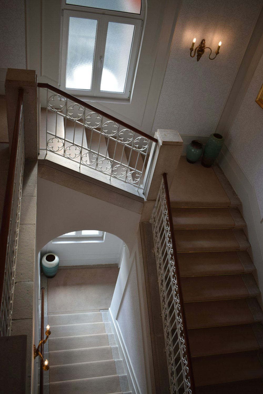 a view of a staircase from the top of the stairs