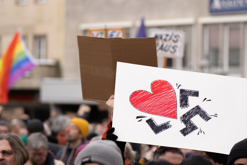 a group of people holding up signs in the air