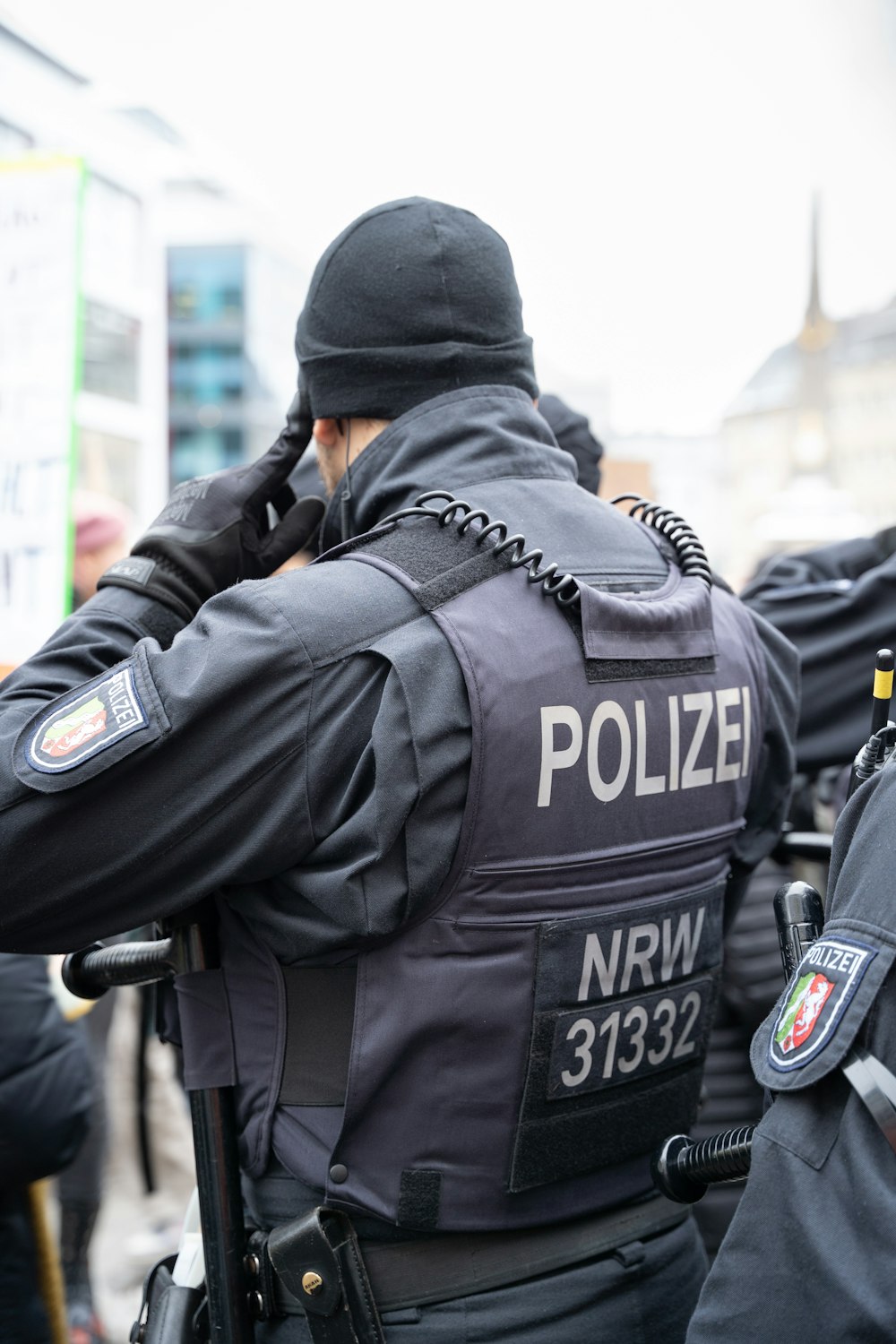 a police officer talking on a cell phone