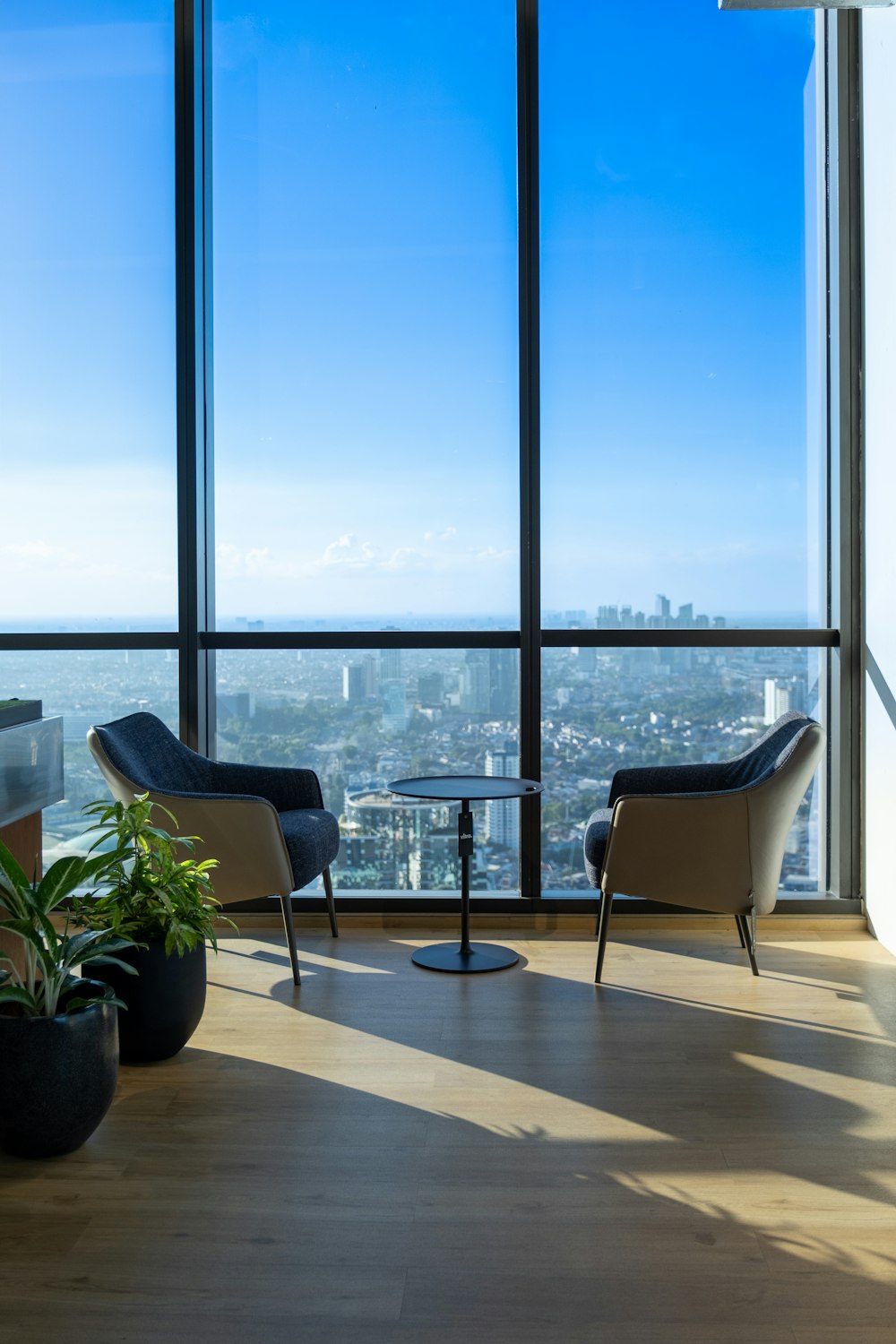 a living room filled with furniture and a large window