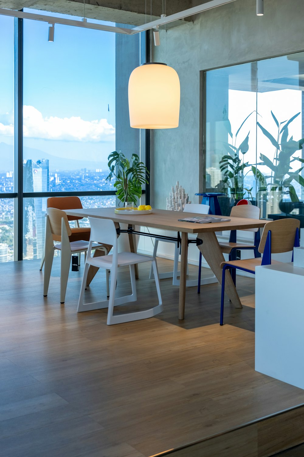 a dining room with a table and chairs