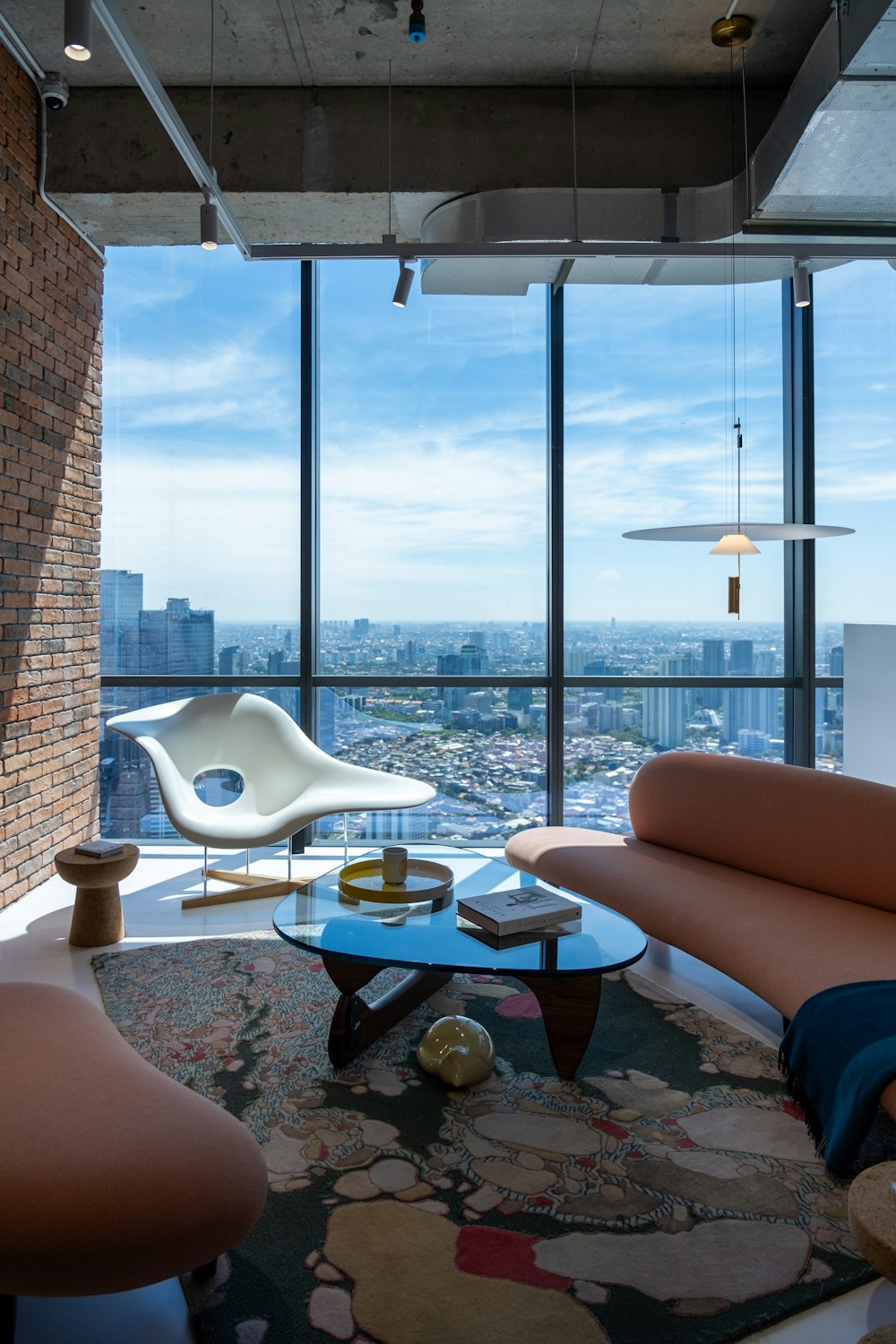 a living room filled with furniture and a large window