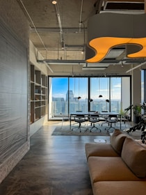 a living room filled with furniture and a large window