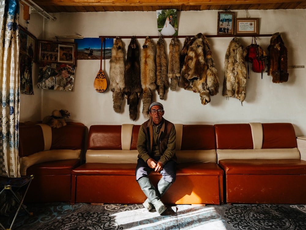 a man sitting on a couch in a living room