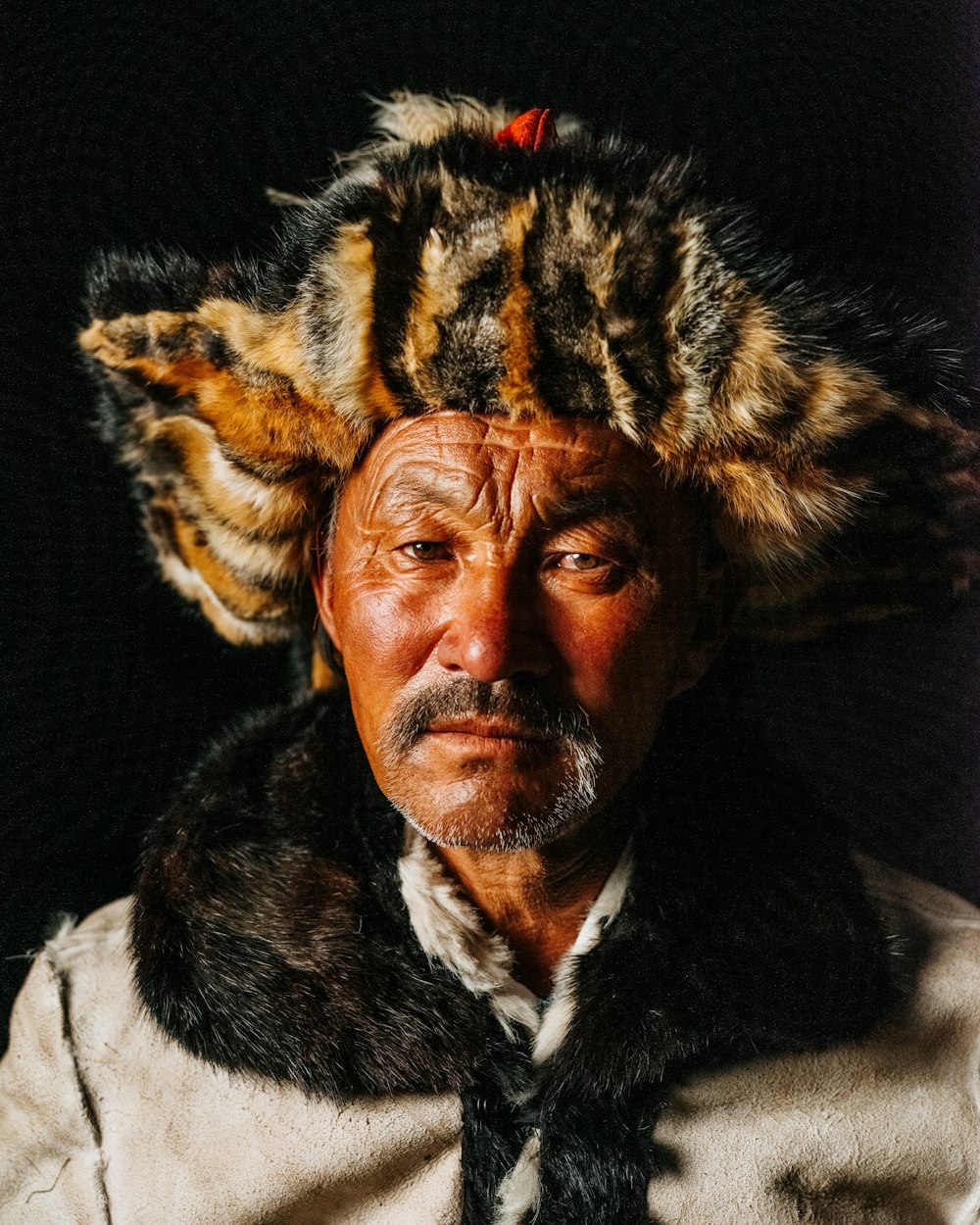 a man with a cat on his head