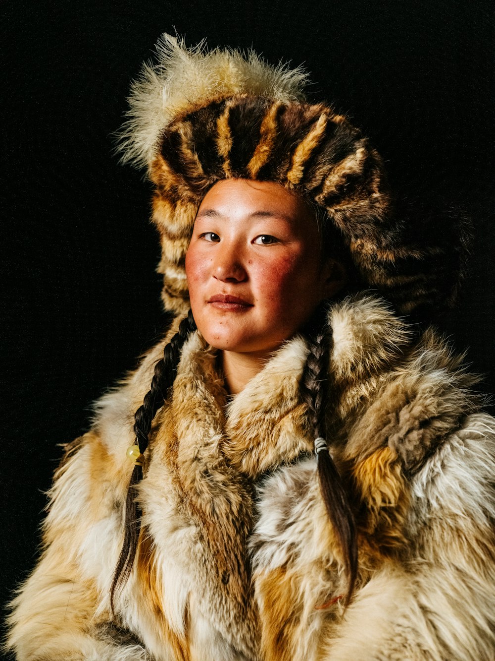 a woman wearing a fur coat and a fur hat