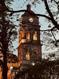 a tall tower with a clock at the top of it