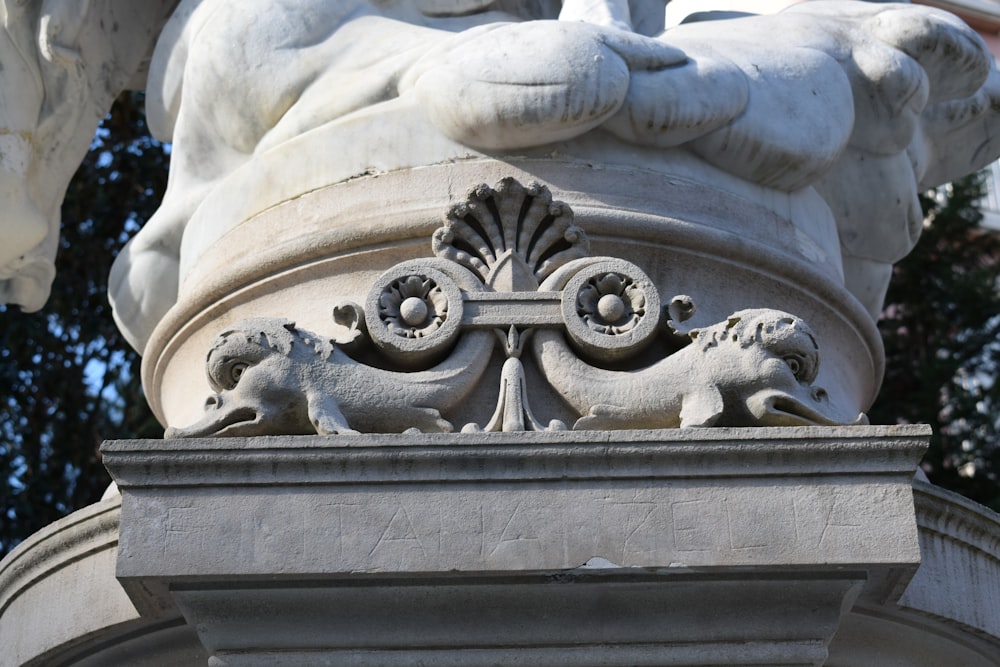 a close up of a statue of a lion on top of a building