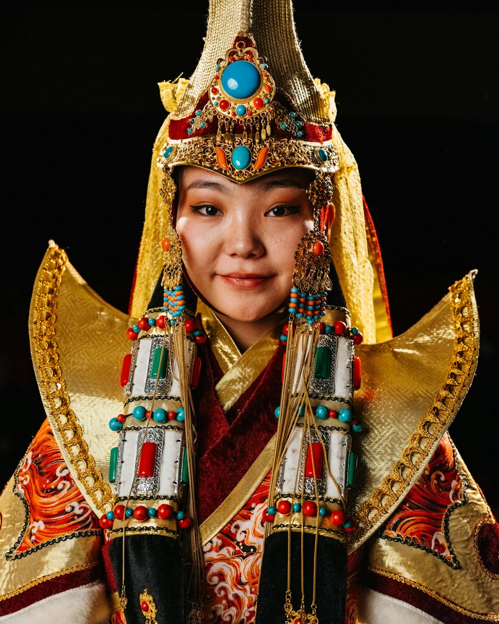 an asian woman wearing a costume and headdress